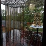 Terrasse bois exotique brise soleil filet camouflage et brise vue en bambou